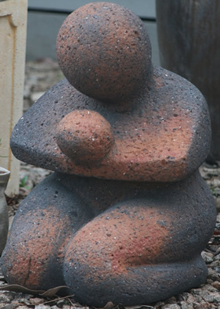 Old stone feature mother and child